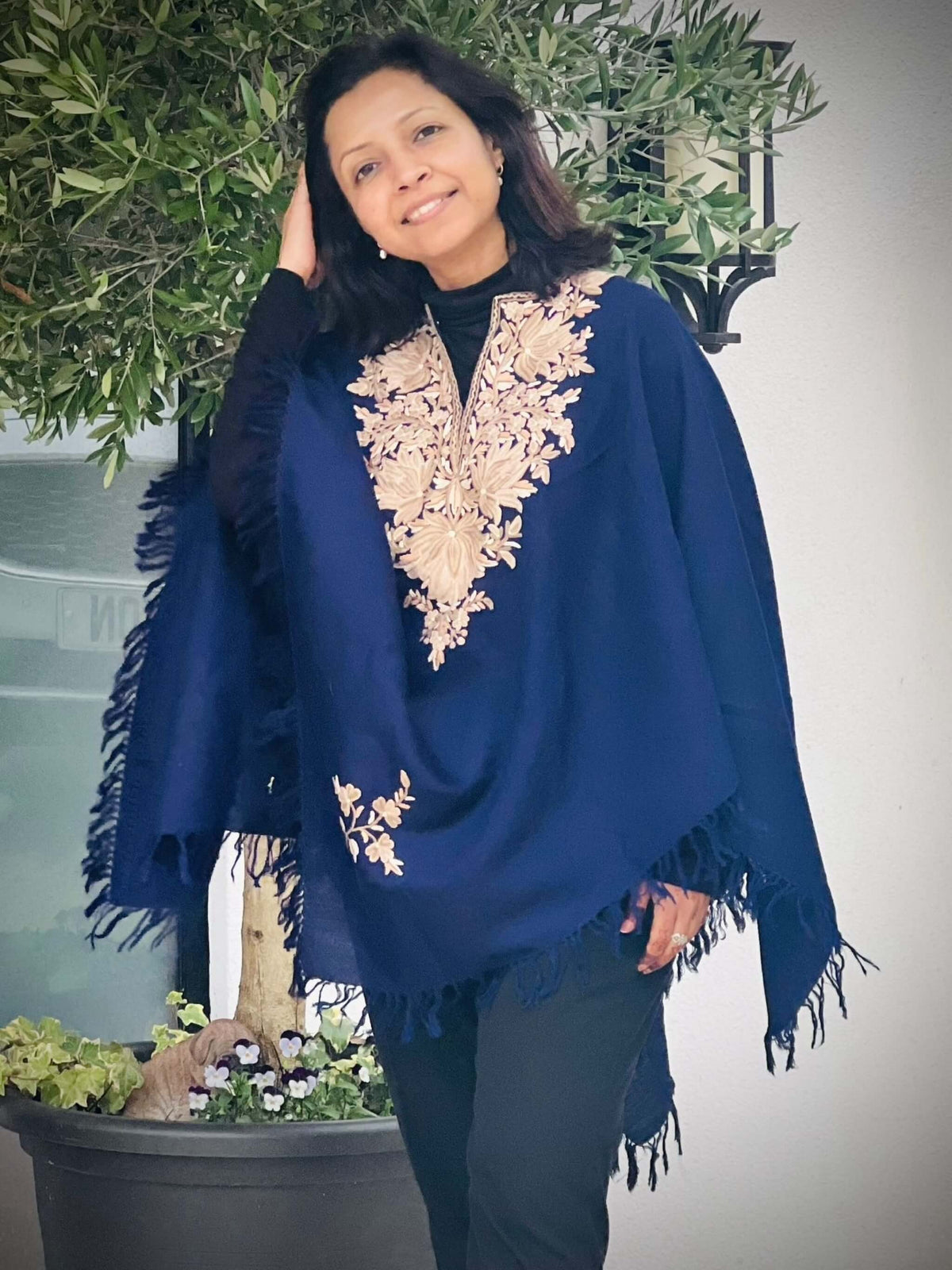 Hand embroidered wool ponchos